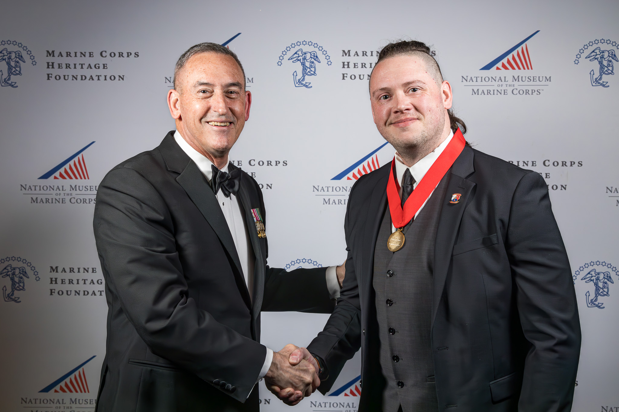 Fortier receiving the coveted Robert A. Gannon award for his poetry book, Phantoms